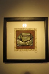 Image of "They have a shield Nothing must be revealed" hand painted can framed