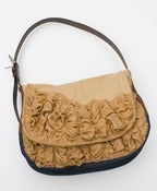Image of a large tough ruffles shoulder bag in toasted almond and amber