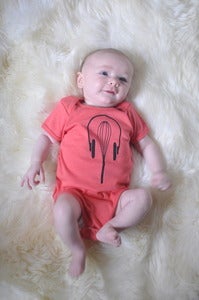 Image of Unisex Organic Baby Onesie: Whisk + Headphones (Pomegranate)