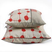 Image of pair of spotcheck redrust cushions