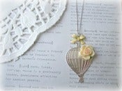Image of Silver Hot Air Balloon Necklace with Yellow Flower