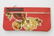 Image of double zip clutch in tomato with vintage floral appliques (a)
