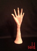 Image of A sculpture of a hand