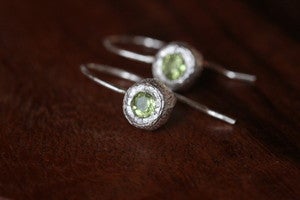 Image of silver bud earrings with peridot