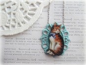 Image of Pussy Cat with Blue Ribbon in Blue Frame Necklace
