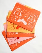 Image of Face Folder 3 pack-- pink, orange, yellow.