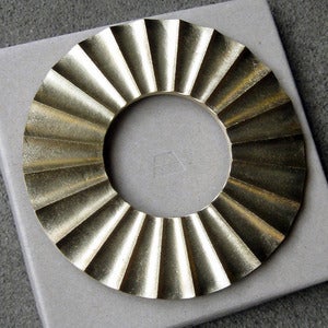 Image of sun brass trivet