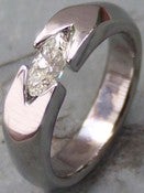 Image of Tension Set Band Half Carat Horizontal Marquee Cut Near Colorless Diamond Ring