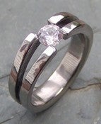 Image of Graceful Titanium Band Half Carat Certified Near Colorless Diamond Tension Set Ring