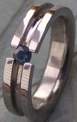 Image of Titanium Striped Tension Set Band - Brilliant Cut Blue Sapphire Ring