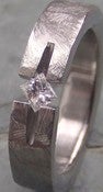 Image of Titanium Ground Notch Band Appraised 1/5 Carat Princess Cut Near Colorless Diamond Ring