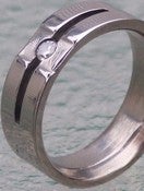 Image of Titanium Ring Slit Design Band Tension Set Round Diamond