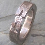 Image of Titanium Ground Notch Band Appraised Quarter Carat Round Colorless Diamond Ring