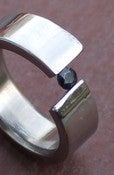 Image of Titanium Tension Set Ring Off Center Band Blue Sapphire