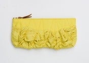 Image of a roundy-bottomed tough ruffles zipper purse in perfect yellows