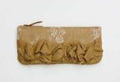 Image of roundy-bottomed tough ruffles zipper purse in vintage lace + beige