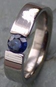 Image of Titanium Super Shiny Band Tension Set Half Carat Blue Sapphire Ring