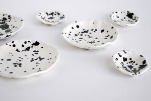 Image of Speckled black & white stack dishes