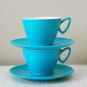 View two turquoise Gaydon Melmex cups and saucers