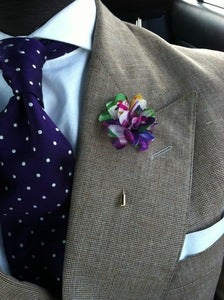 Image of purple floral lapel flower (fl)