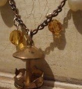 Image of here we go round the merry go round necklace