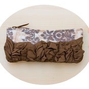 Image of roundy-bottomed tough ruffles zipper purse in salmon+mushroom ikat with chocolate brown