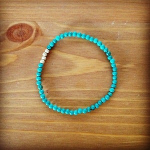 Image of turquoise and gold bead bracelet