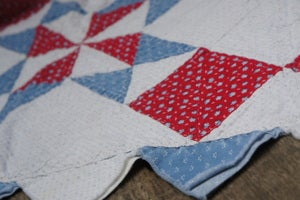 Image of Vintage, Comfortably Worn Patriotic Quilt with Triangle edges