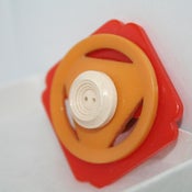 Image of vintage styled orange white and yellow buckle and button brooch