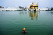 Image of Bathing Sikh. Armristar, India