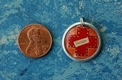 Image of Orange Badge of  Peregrination charm