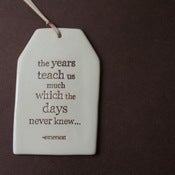 Image of ceramic quote tag - the years teach us much