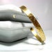 Image of birch bark cuff. bracelet. brass.