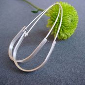 Image of modern teardrop hoops