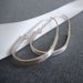 Image of modern teardrop hoops