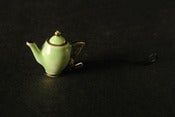 Image of green and gold teapot phone charm