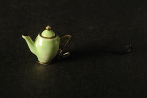 Image of green and gold teapot phone charm