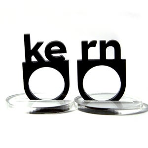 Image of typographic KERN ring set