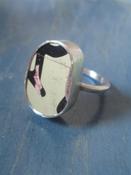 Image of chunky silver ring letter r/biege