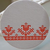 Image of cross-stitch letterpress coasters