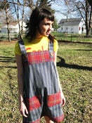 Image of blue stripe and red plaid jumper with large buttons
