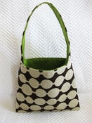 Image of white dot on brown/ lime green