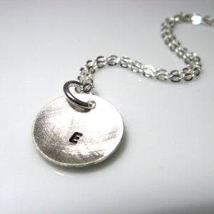 Image of initial pod. circle. necklace. sterling silver.