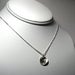 Image of initial pod. circle. necklace. sterling silver.