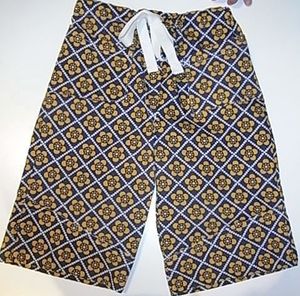 Image of tom boy pants  navy and mustard pattern