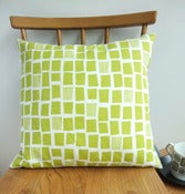 Image of city windows cushion in lime on white linen
