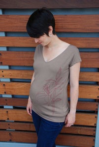 Image of lily on brown banded maternity tunic