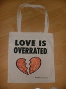 Image of LOVE IS OVERRATED TOTE BAG