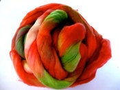Image of rolling the berries: 100% merino wool combed top 8oz, 225 grams.