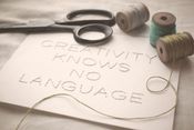 Image of Hand-stitched 5x7 Quote: "Creativity Knows No Language"